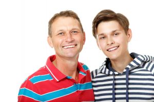 Father with son teen happy smiling over white background